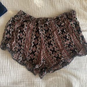 red and black patterned flowy shorts